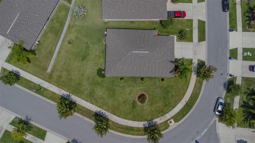 THE ENTIRE CORNER LOT!