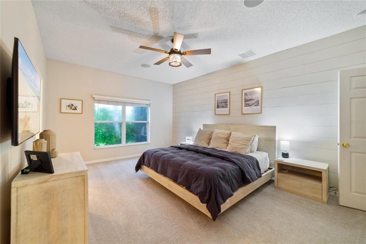 Your primary suite is another relaxing space, featuring a huge WALK-IN CLOSET and CUSTOM SHIPLAP accent wall!