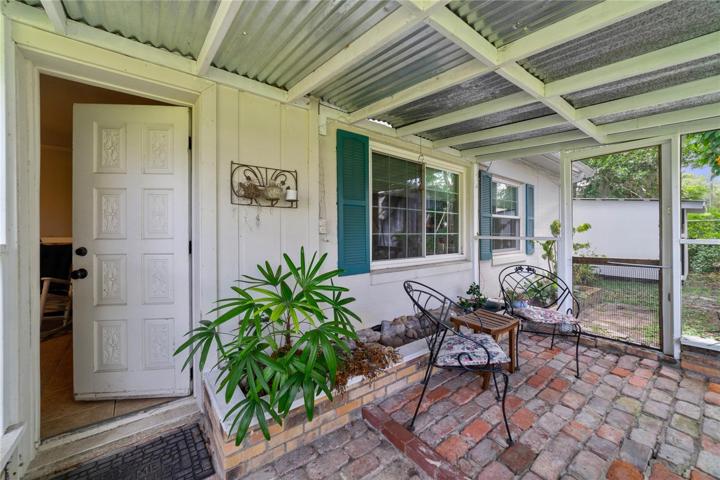 Unwind after a long day on the cozy BACK PORCH, and relax in the shade of the mature trees!