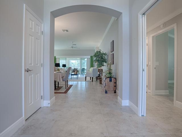 POCKET DOOR TO THE RIGHT LEADS TO THE GUEST SUITE AND 2 GUEST BATHS.  COAT CLOSET ON THE LEFT.