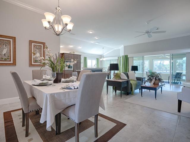 CROWN MOLDING AND CORNICES OVER THE SLIDING GLASS DOORS.