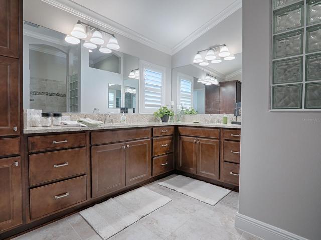 LOVELY BATH WITH QUARTZ COUNTER TOPS, CROWN MOLDING AND LINEN CLOSET,