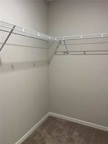 Walk in closet in principal bathroom
