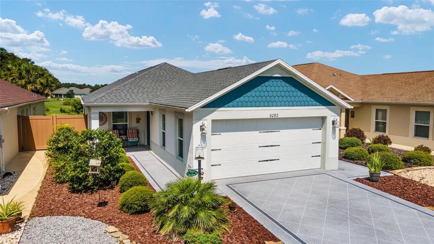 GOLF COURSE VIEW ... NICELY UPGRADED 3/2 "ANEHEIM" COURTYARD VILLA IN THE VILLAGE OF McCLURE.TWO CAR GARAGE!