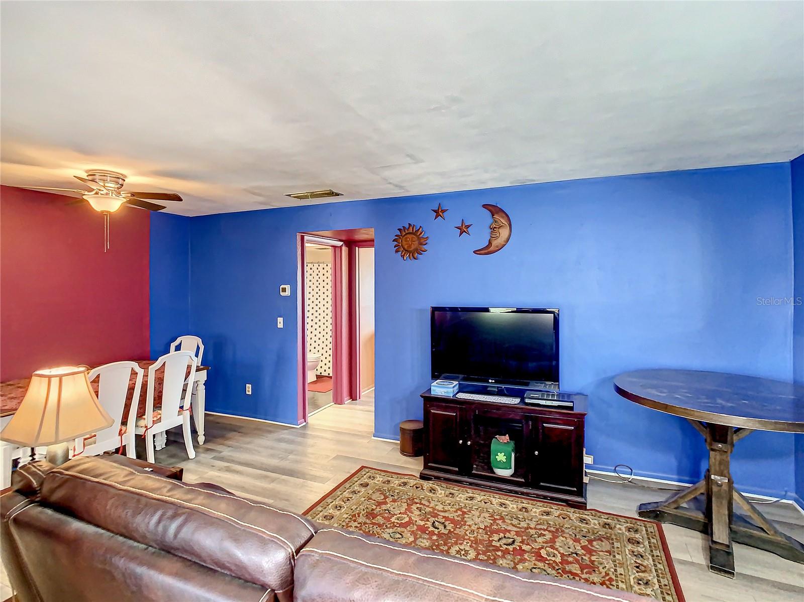 Living room looking towards dining area &amp; hall to bath &amp; bedroom