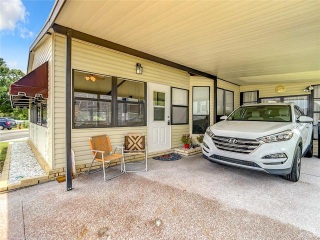 Carport and entrance into Florida room