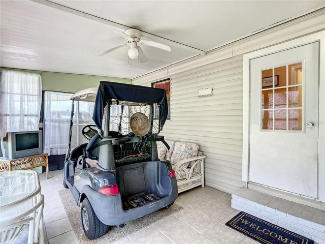 This Florida room has tile and double doors so you can also store a golfcart here