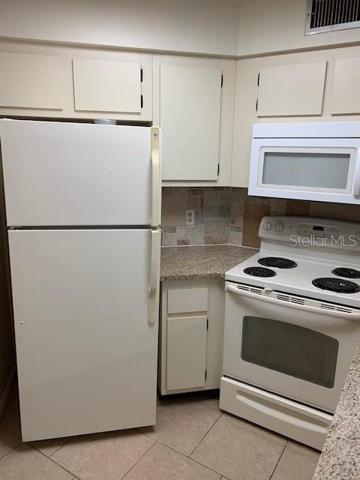 Kitchen features stunning granite countertops
