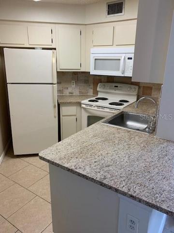 Kitchen offers breakfast counter