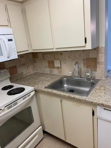 kitchen sink with disposal and dishwasher.