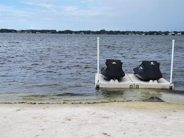 Floating dock and and wave runners convey with the sale of the home.