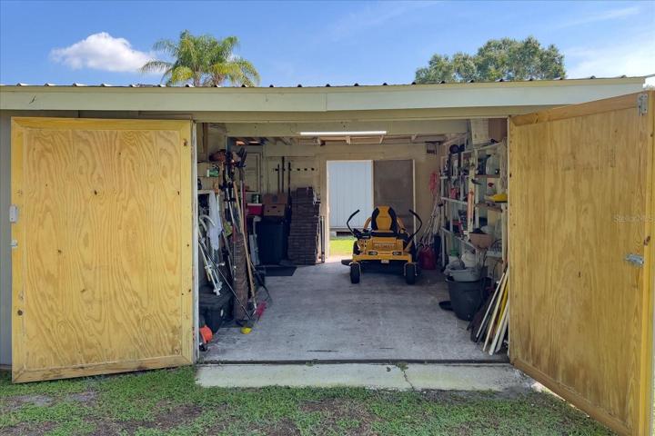 This is a 3rd Shed further back on the property.  It is a large workshop, which also has electricity connected.