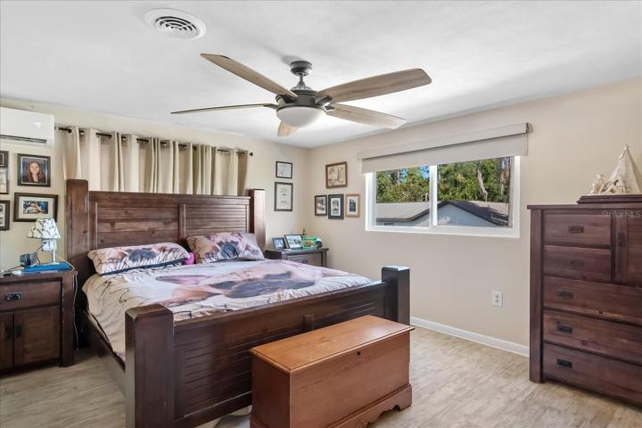 The master bedroom is spacious, bright and comfortable with lovely laminate flooring.