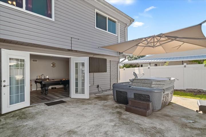 Large back patio, in a fully fenced area for privacy, is ready for just about any activity.  The spa can be left, but the seller is not offering any warranty on the item.
