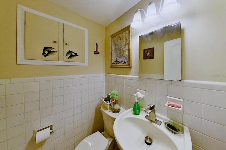 This is the 1/2 bath just to the right of the office, clean and updated.