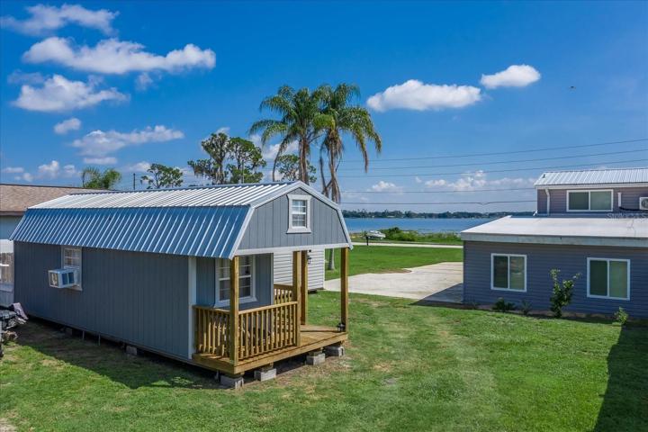 This 10 x 32' shed is electric connected, insulated, has A/C and some dry wall already installed.  There is even a loft on the inside.