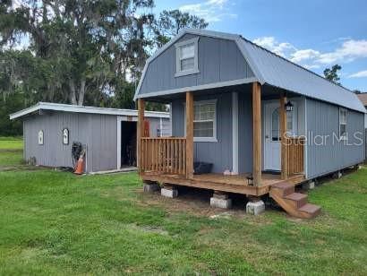 10 x 32' shed with A/C, insulation and electric.  With some finishing work of drywall, and small kitchen this could be income generating.