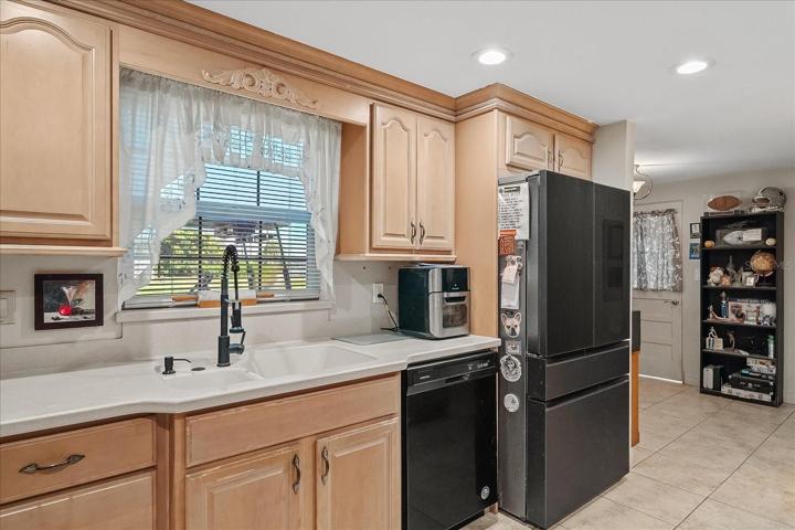 This view from the kitchen looks into the office.  Notice the refrigerator!