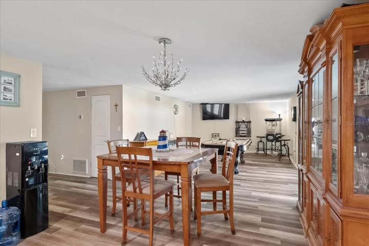 This is the view from the kitchen, so it is open to both the dining area and the game room.