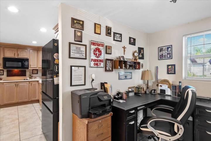 Just off of the kitchen is a space currently used as an office.