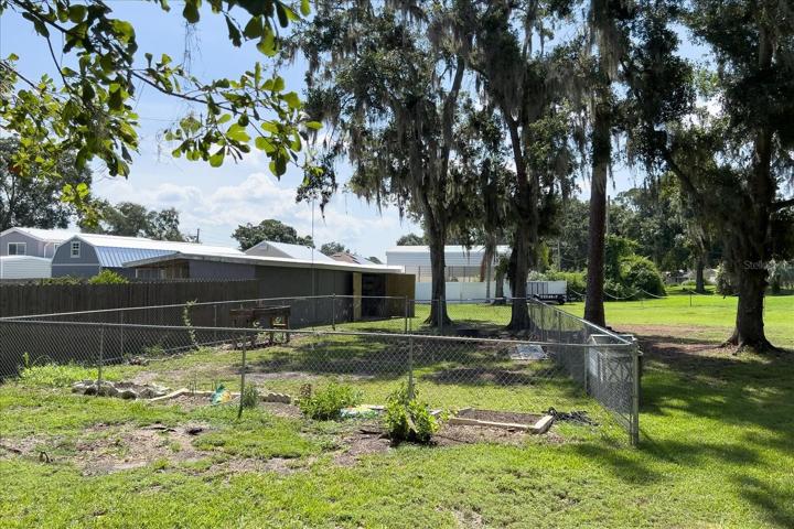 Inside the gate is an area that is being developed for gardening, or whatever a new owner deems as a new purpose.