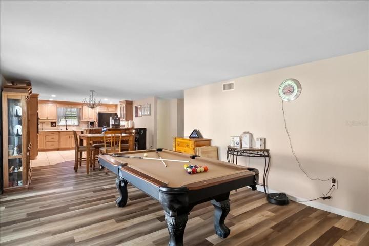 Plenty of room for games, entertaining and family enjoyment.  Soft Neutral tones, make this a relaxing and fun space.