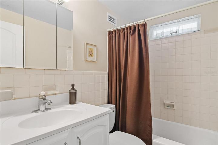 Guest bedroom is bright and clean.