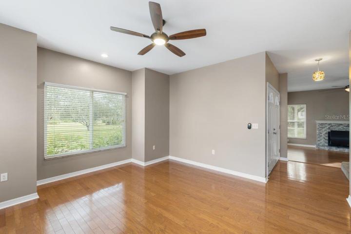 Dining Room located off the main entry way featuring wood floors and several windows providing lots of natural light!