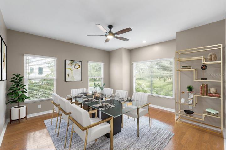 Dining Room located off the main entry way featuring wood floors and several windows providing lots of natural light!