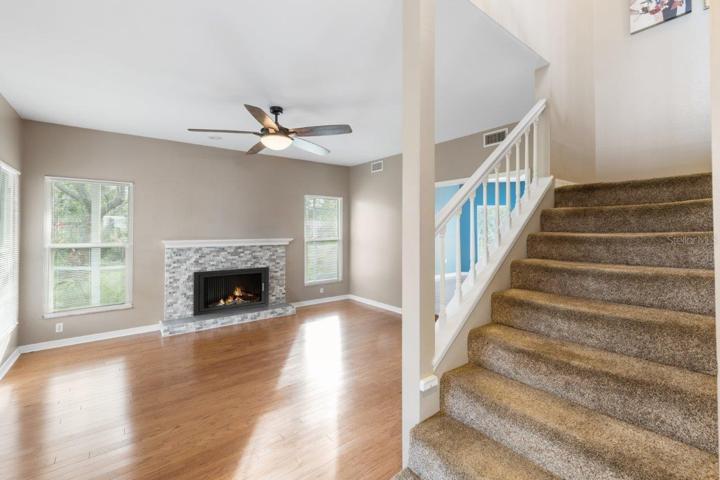 Front entry way featuring double doors, direct access to the living room and second floor.