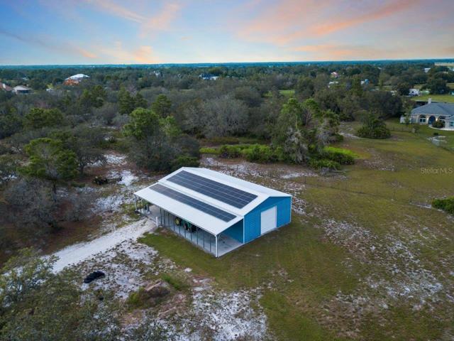 Arial of the 60'x30' warehouse featuring the 49 solar panels.