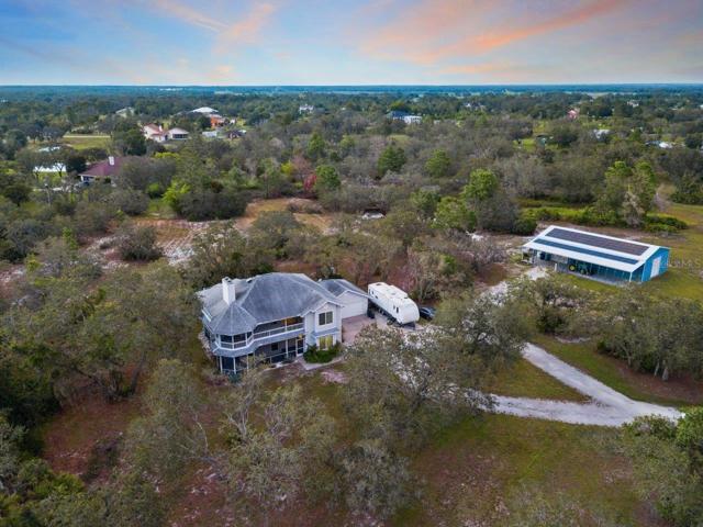 Arial of the home showing the distance from the 60'x30' warehouse.