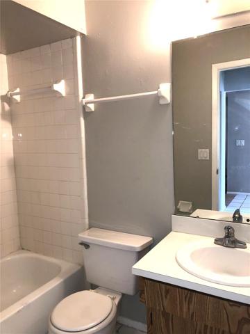 Guest bathroom has tub