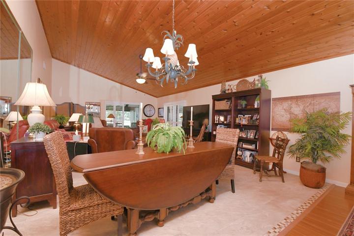 Luxury ceramic plank tile flooring underfoot  throughout the dining and living room.