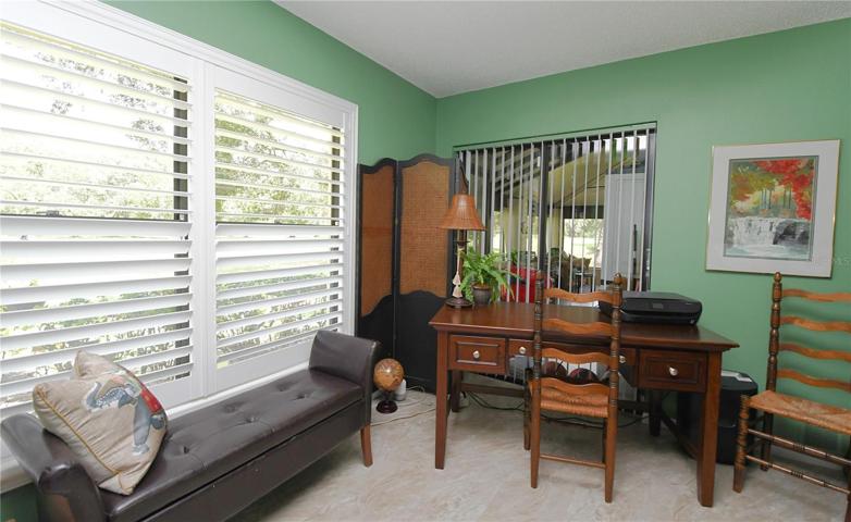 The master bedroom features sliding glass doors to the enclosed back porch.