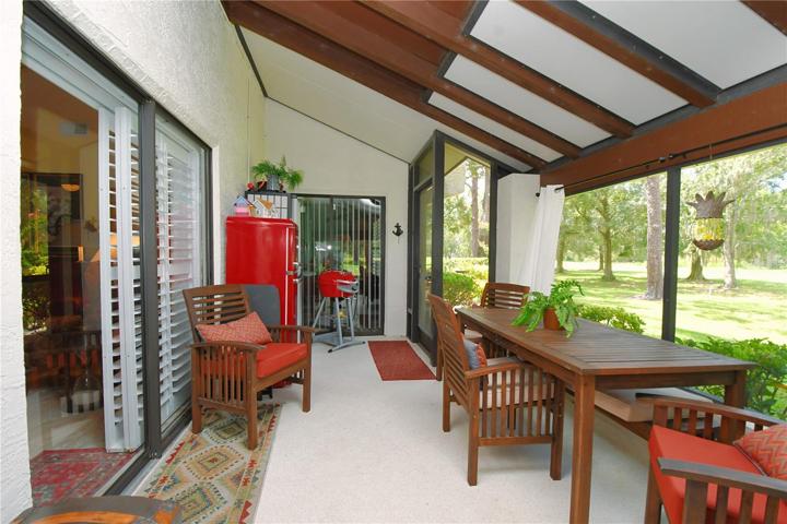 The vaulted, beam ceiling enhances the indoor outdoor living space.