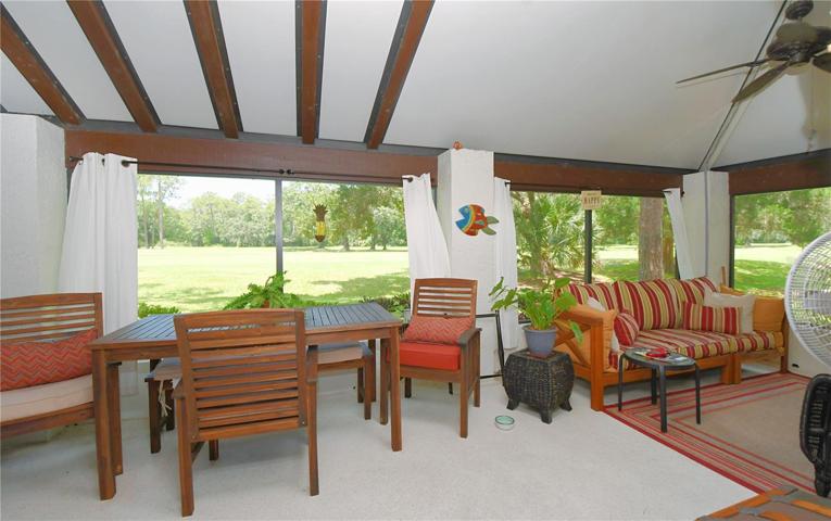 Venture out to the expansive screened-in back patio with a vaulted ceiling, a showstopper with an unrivaled garden, and golf course vistas.