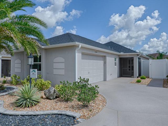 LOVELY 3/2 "CHARLOTTE" COURTYARD VILLA WITH ALL NEW ROCK BED LANDSCAPING, STACKED STONE CURBING AND LOVELY SHRUBS AND PALMS AROUND THE ENTIRE HOME.  GUTTERS ALL AROUND TOO!