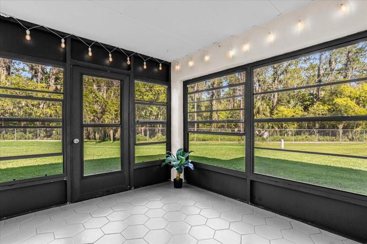 Sunroom overlooking Natural Park. Tile flooring!