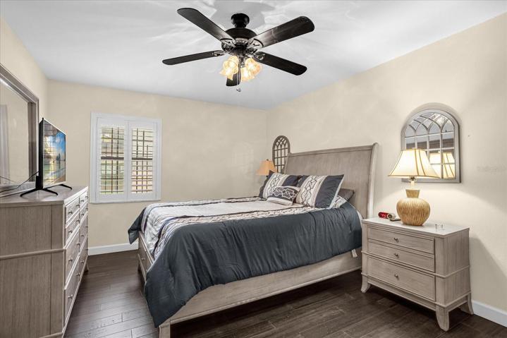 Master Bedroom with Custom White Plantation Shutters