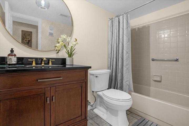 Bathroom 2 - marble flooring, beautiful vanity with granite top