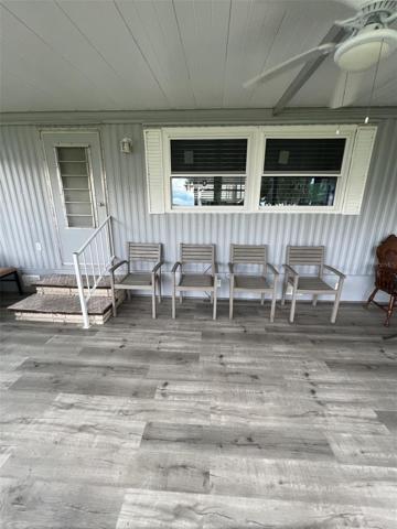 Florida room faces the lake and has central AC