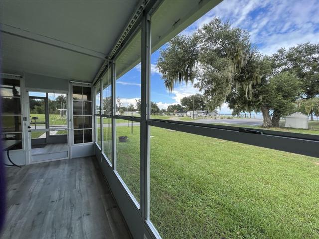 Side yard with lake view.  Also, steps to the clubhouse.