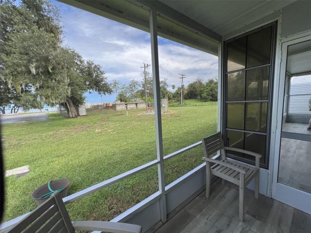 Front screened lanai with view of the lake
