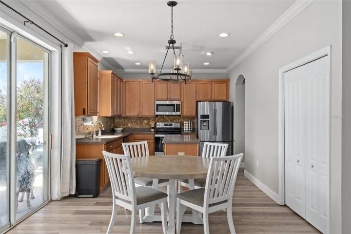 Kitchen Nook Area with NEW Luxury Flooring, Pantry and Sliders to Lanai