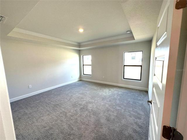 Sample Home - Owners Bedroom with Tray Ceiling w/Crown