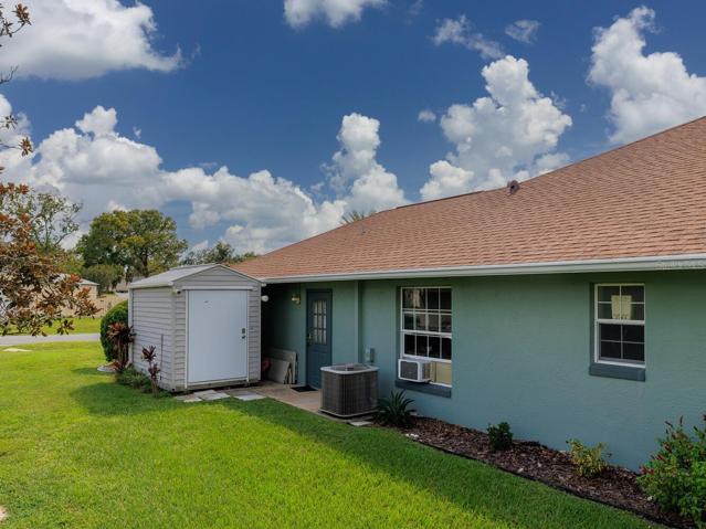 Side of home with shed