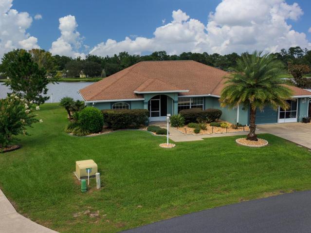 View of home with lake