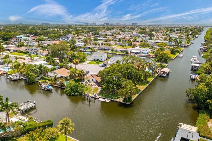 200 FT of Waterfront on Huge (10,200 FT) Corner Lot at end of Cul-du-sac with Mature Trees. Bay Access.
