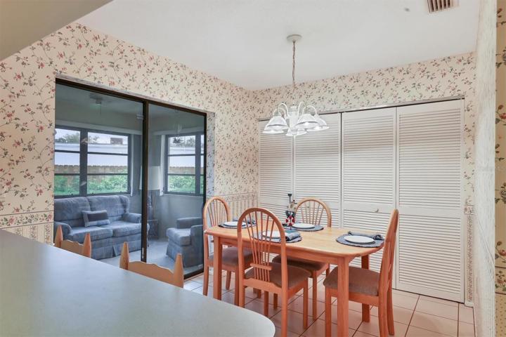Eat-in Kitchen looking into enclosed lanai